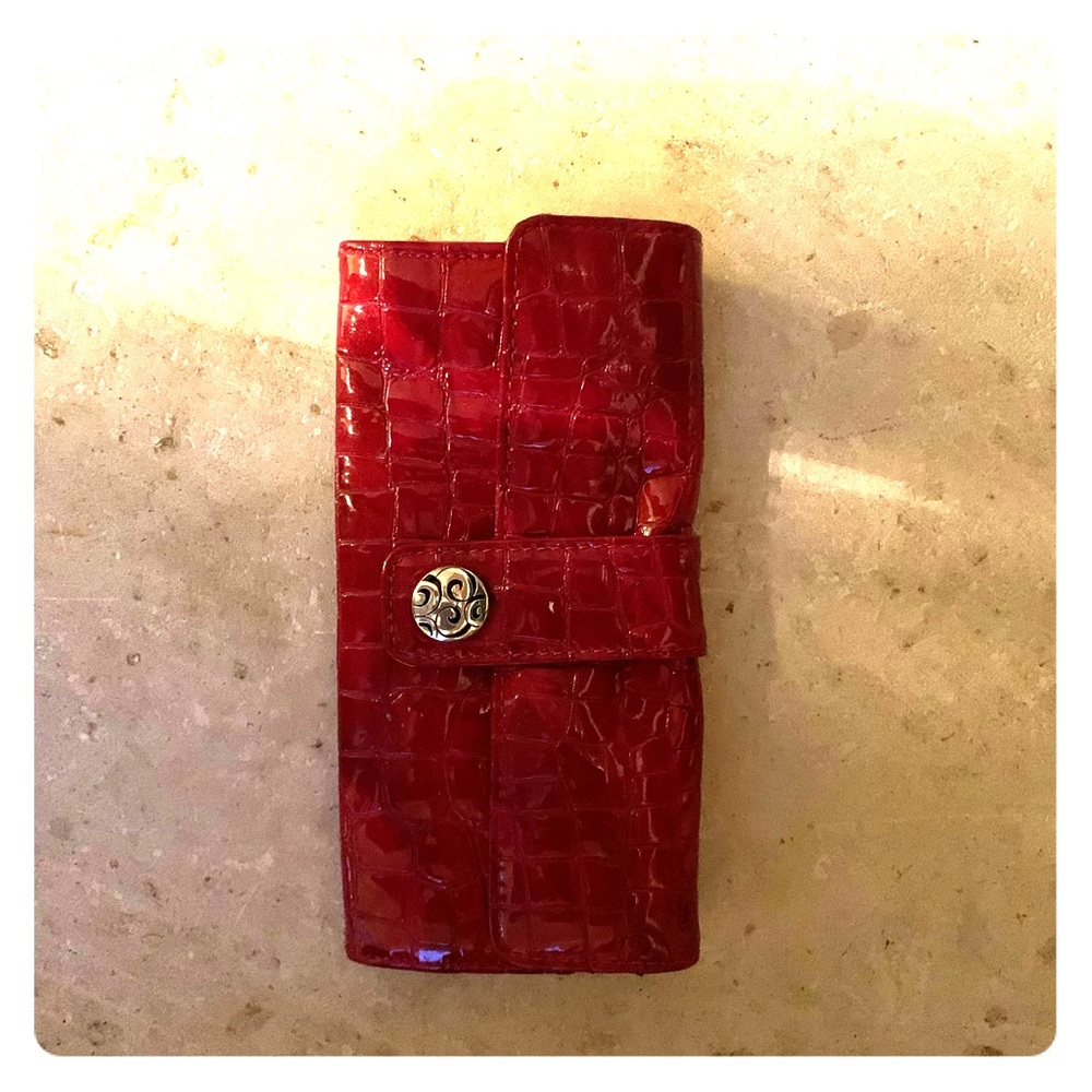 Brighton’s red leather clutch wallet